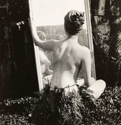 Female nude in fern leaf skirt